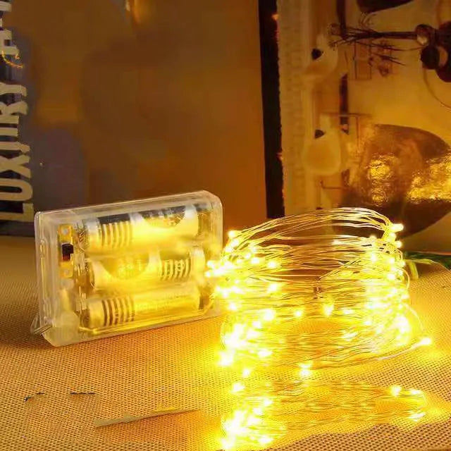 12 metre copper wire LED string lights with 120 bulbs in battery-powered light post