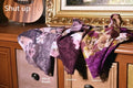 Men's black ice silk mesh mid-waist briefs lying flat, showing ultra-thin fabric texture.