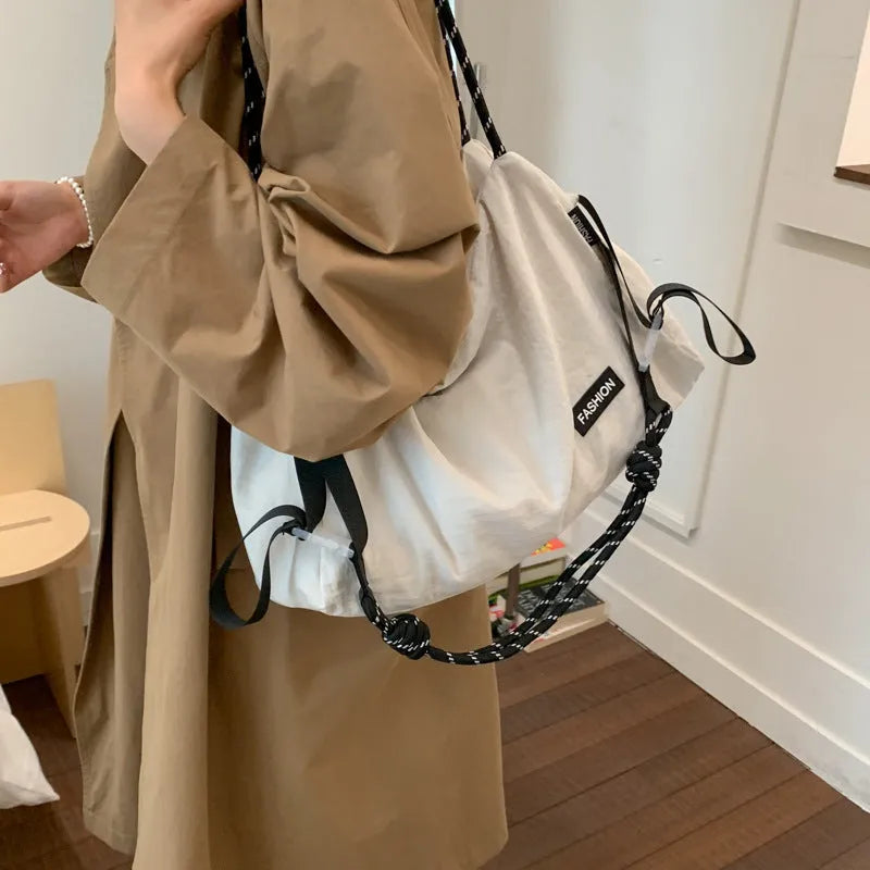 Large capacity soft cloth crossbody bag in beige with sewn detail, available in six colours