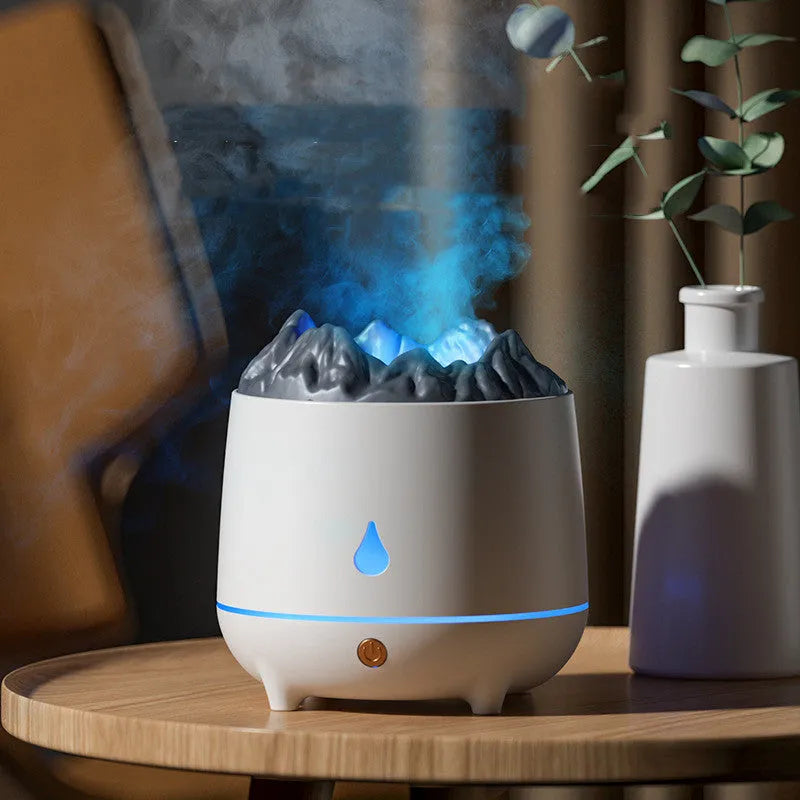 Black volcano-shaped ultrasonic humidifier with USB cable on wooden desk emitting mist