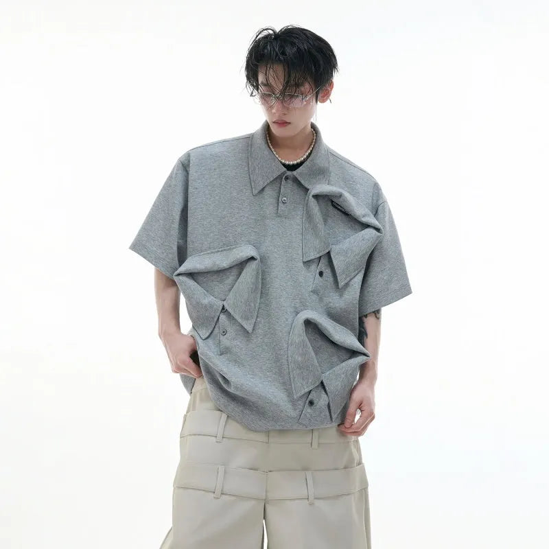 Men's loose fit deconstructed polo shirt with geometric print in black, gray, or white.