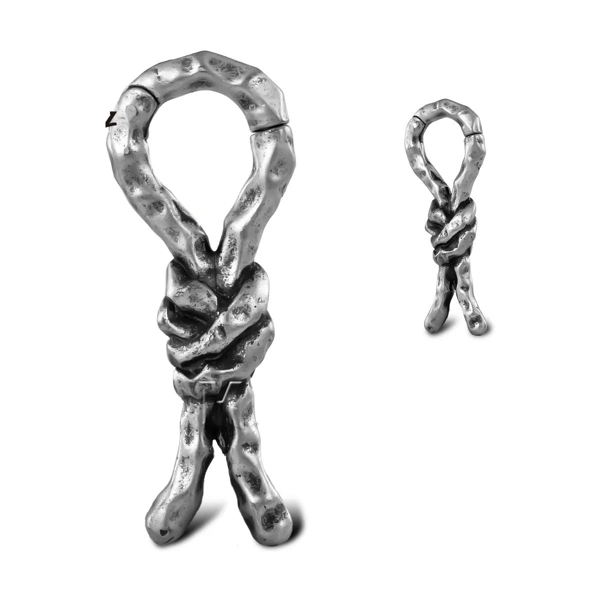 Close-up of a 4mm copper piercing earring with a bending, connecting retro shape.
