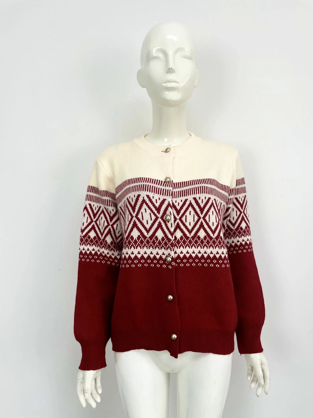 Women's red alpaca wool cardigan with diamond knit pattern and contrast colour long sleeves.