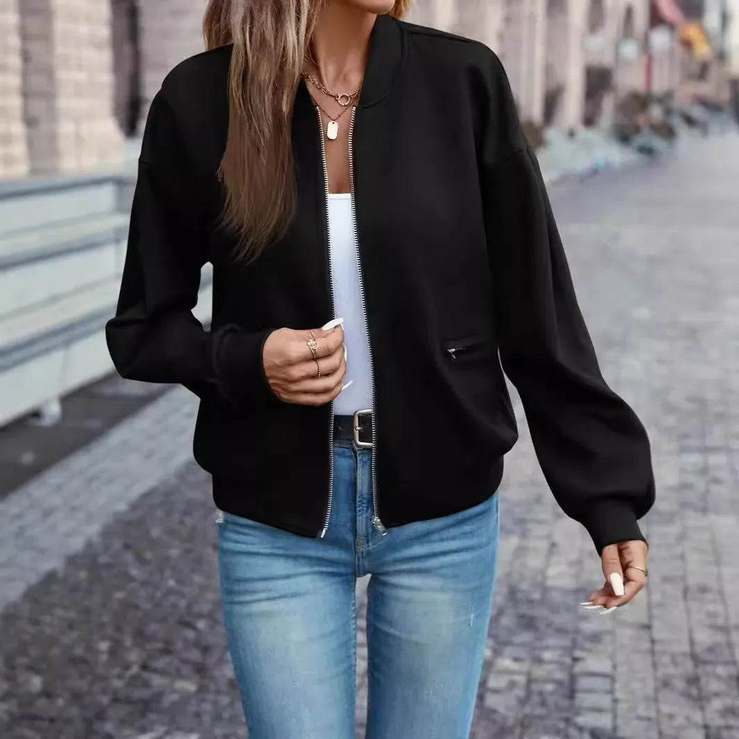 Women's black polyester zip jacket with long sleeves and faux pocket detailing