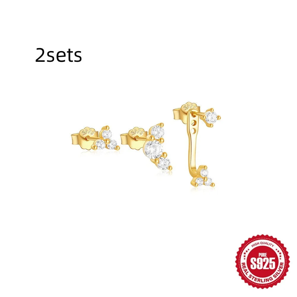 Three pairs of geometric zircon tassel earrings in sterling silver with gold tone variations