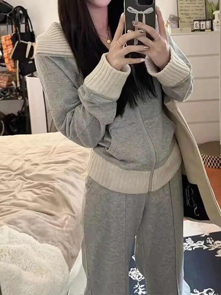 Light gray women's casual two-piece set with coat having pockets and wide leg trousers