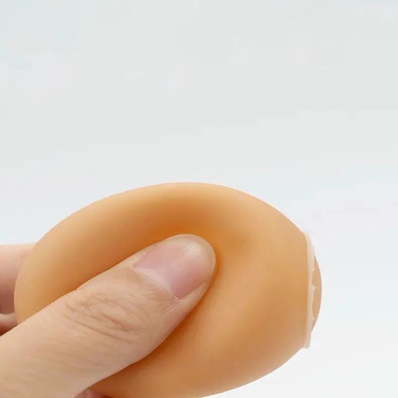 Egg-shaped dog toy with textured surface for tooth cleaning and sound feature