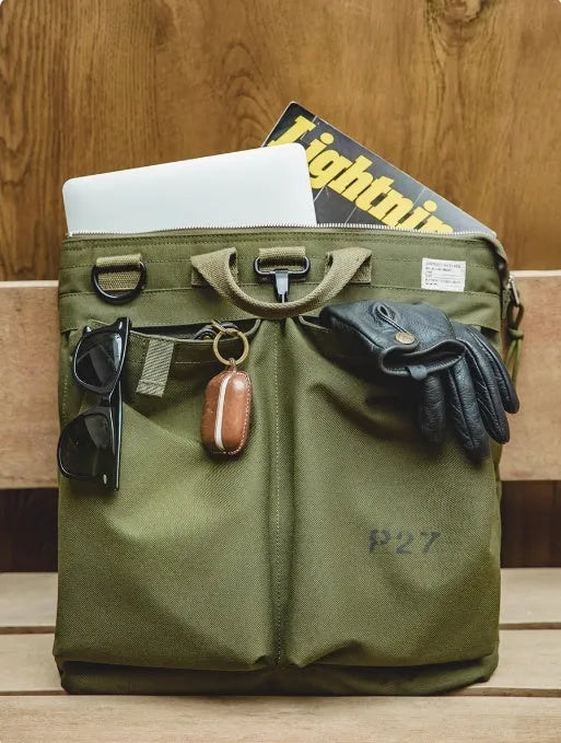 Retro style canvas crossbody messenger bag in military green with adjustable shoulder strap and zipper closure