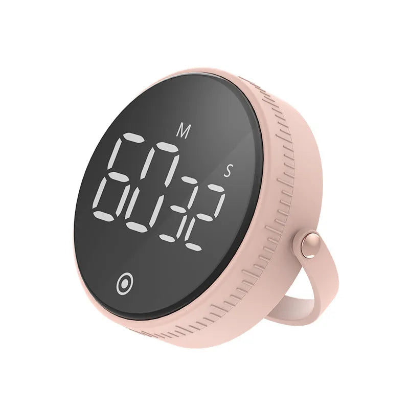 Black digital kitchen timer with rotary dial and LED display showing minutes and seconds