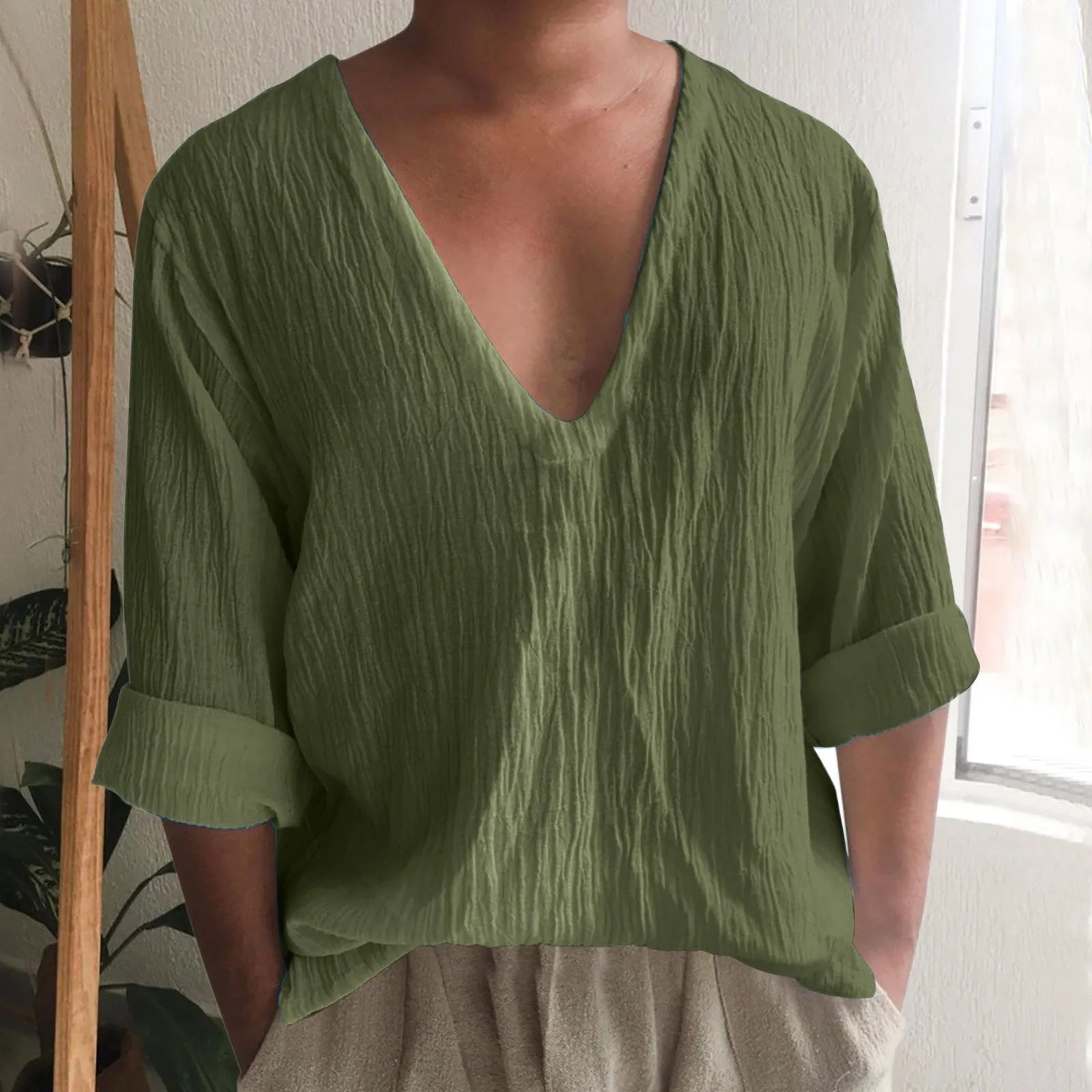 Men's long sleeve V-neck t-shirt in washed cotton fabric, shown in solid colour options.