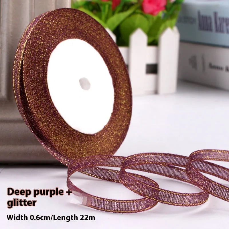 Roll of 0.6cm wide coloured polyester gift ribbon with 22 metre length.
