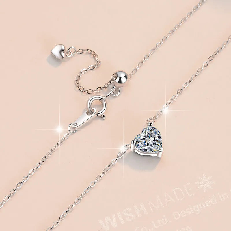 925 silver heart-shaped moissanite pendant necklace with cross chain on display