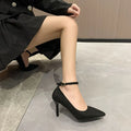 Black women's stiletto heel pump with a buckle detail, shown on a white background.