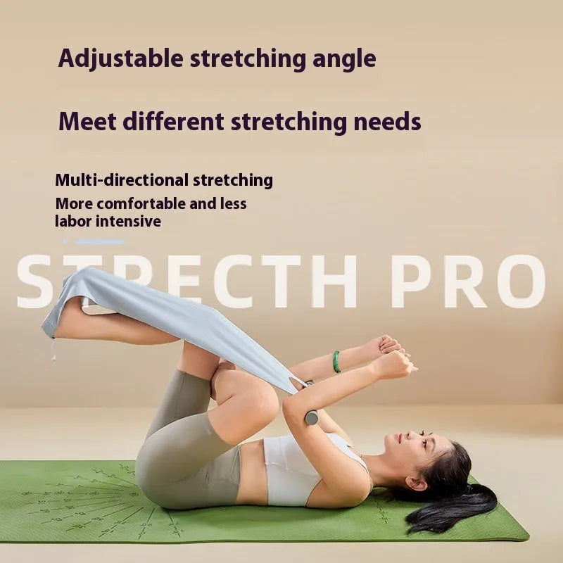 Grey and pink yoga stretching tool for shoulder and hip flexibility on a plain background.