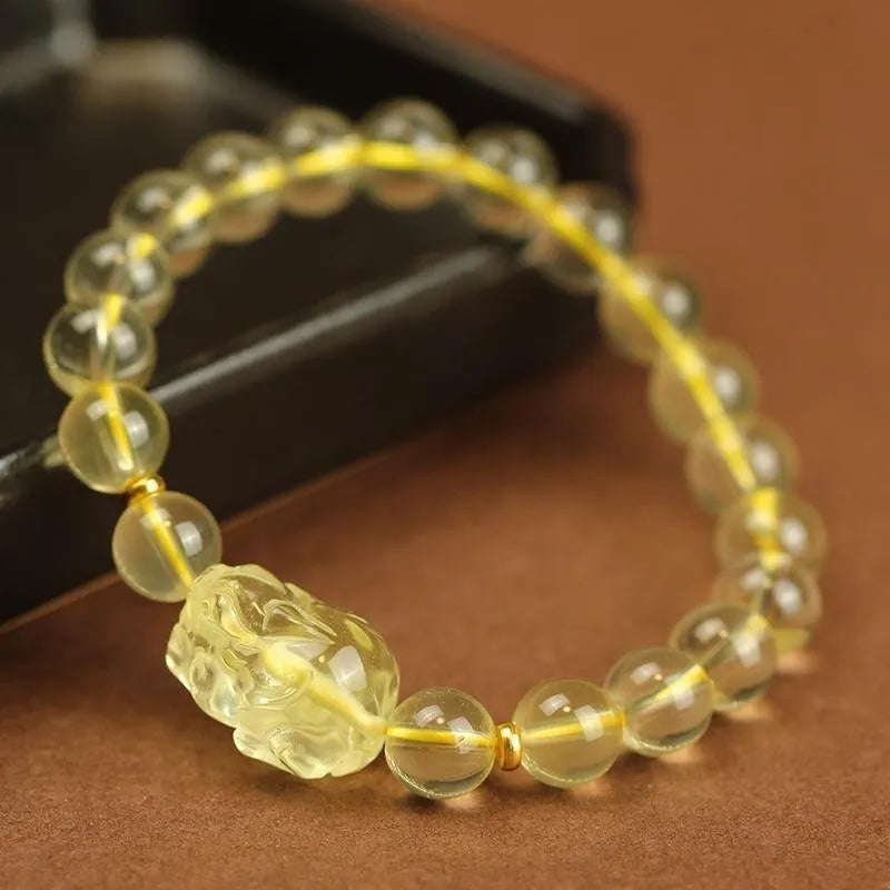 Yellow leather strap Citrine Pi Xiu bracelet with round artificial crystal beads in national folk style.