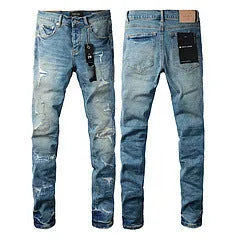A pair of black slim fit skinny jeans with a straight leg and button fly closure on a mannequin.