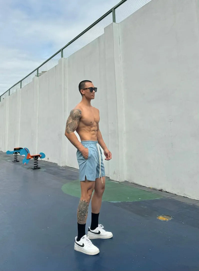 Men's ice silk quick-drying double-layer casual shorts in nylon fabric on a colour swatch background.