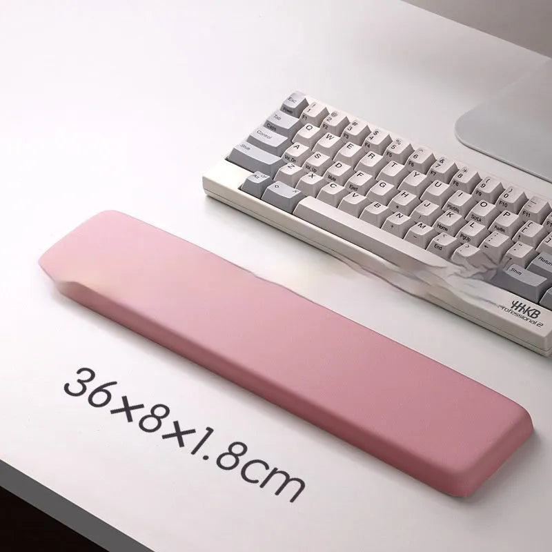 Square silicone wrist rest mouse pad with wrist strap in multiple colour options on a desk
