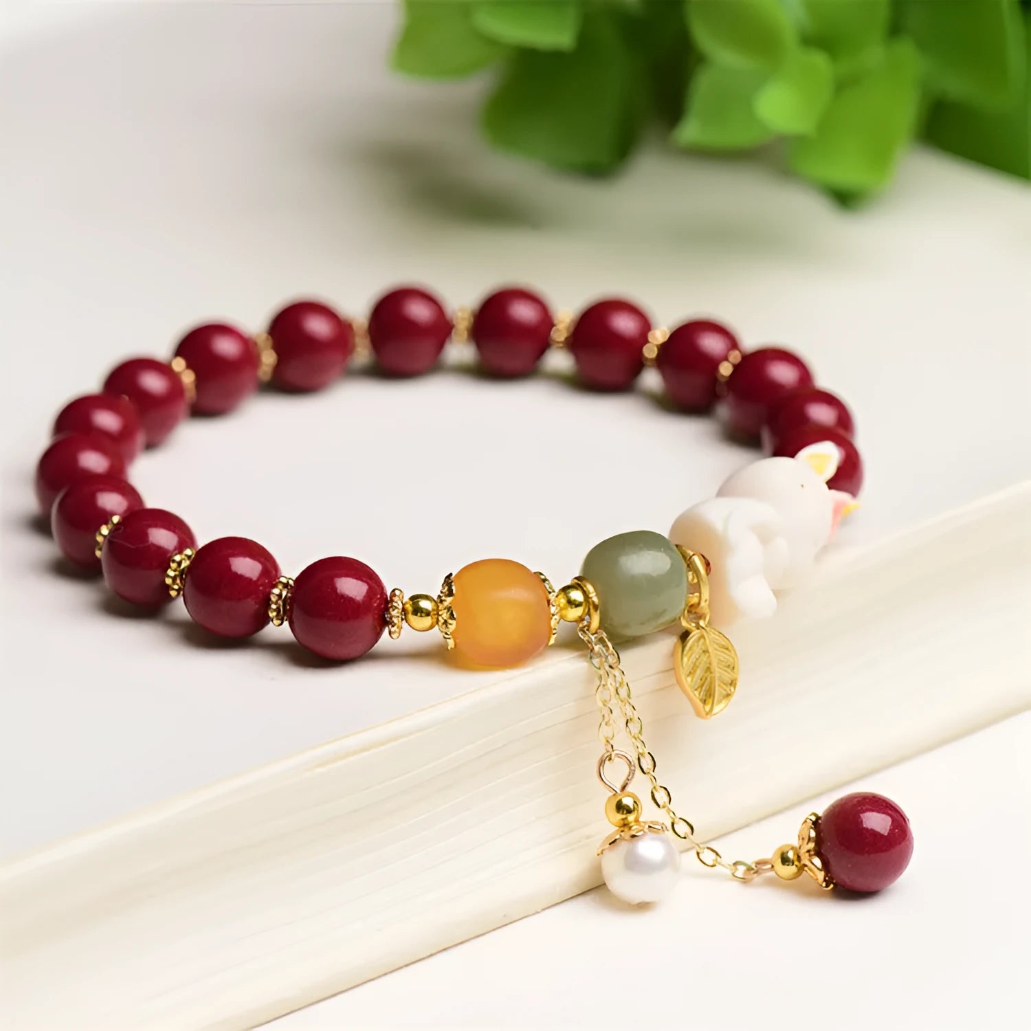 Traditional Chinese cinnabar bracelet with rabbit design, available in 8mm and 10mm bead sizes.