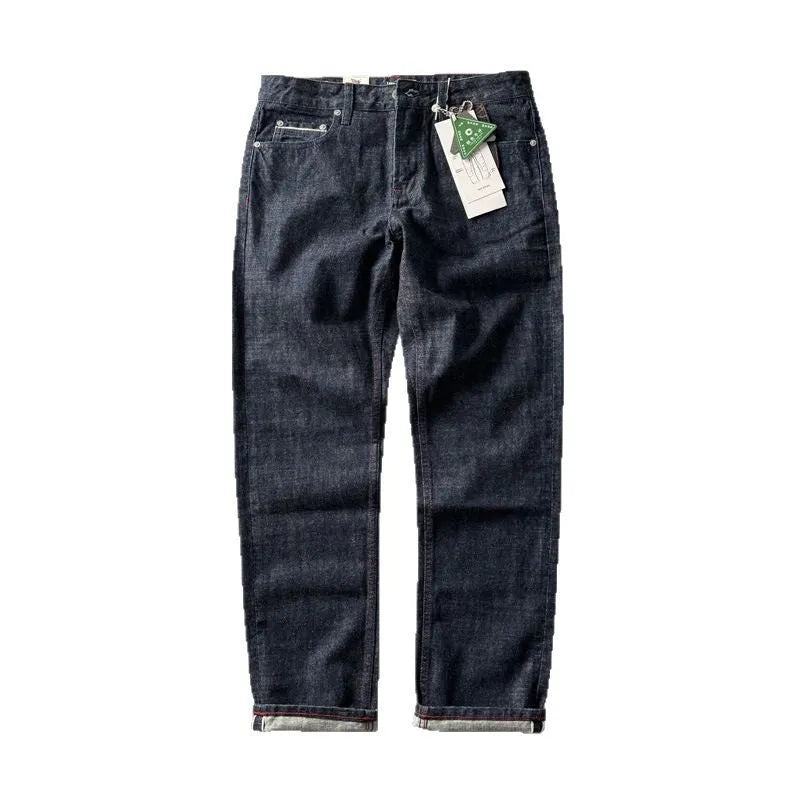 Men's straight leg denim trousers in a primary blue wash, showing front view on a hanger.