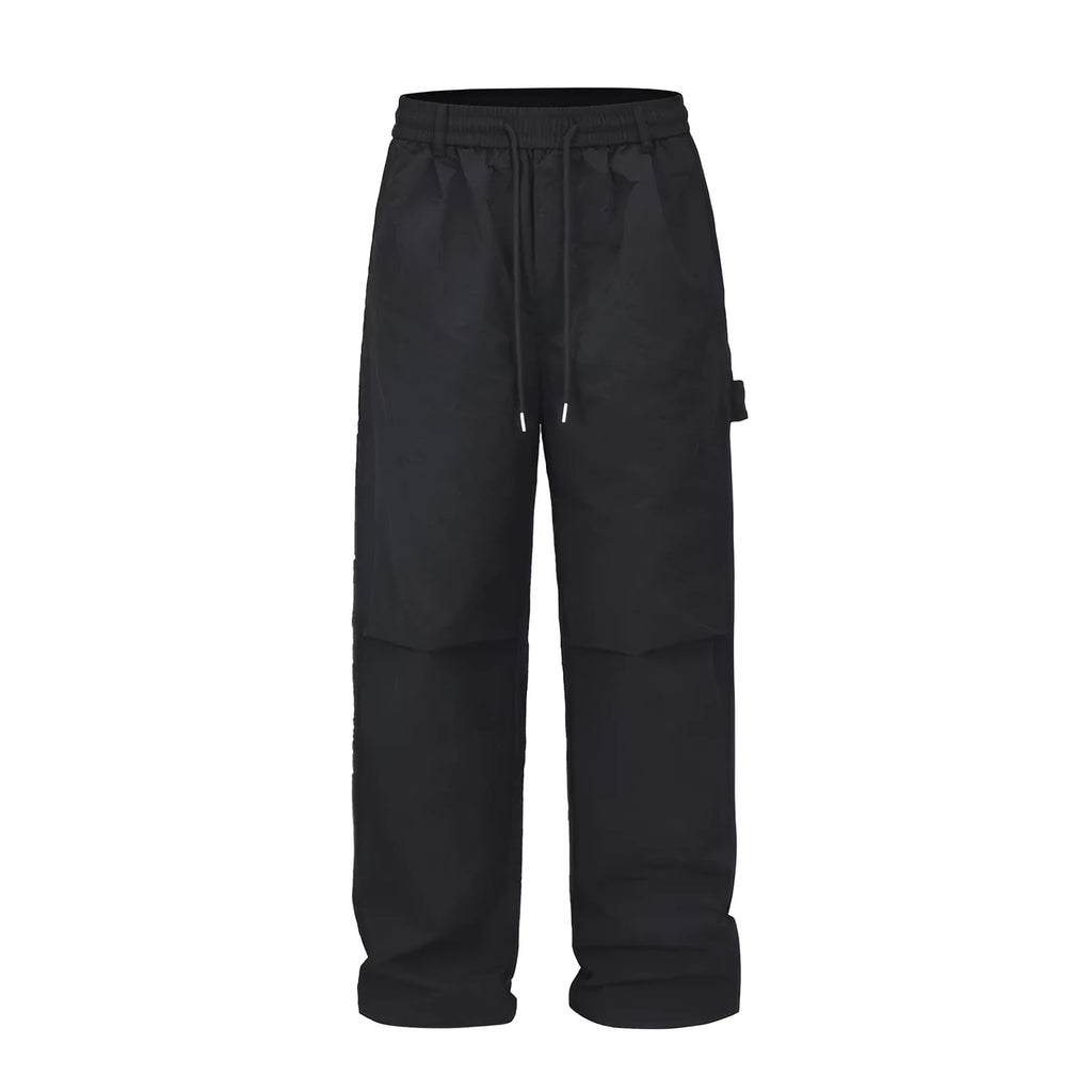 Black paratrooper pants with elastic waist, three-dimensional cutting, and baggy fit