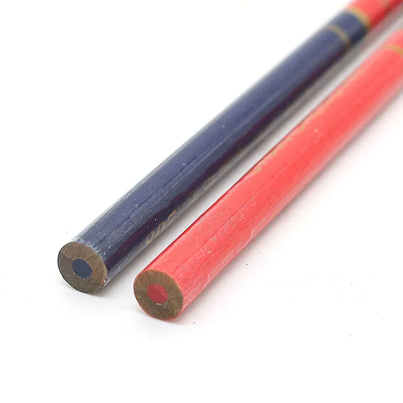 Ten red and blue wooden carpenter pencils with round barrels arranged together.