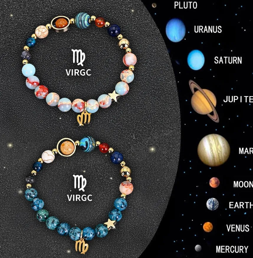 Set of two natural stone beaded bracelets showing zodiac sign charms on a wooden surface.