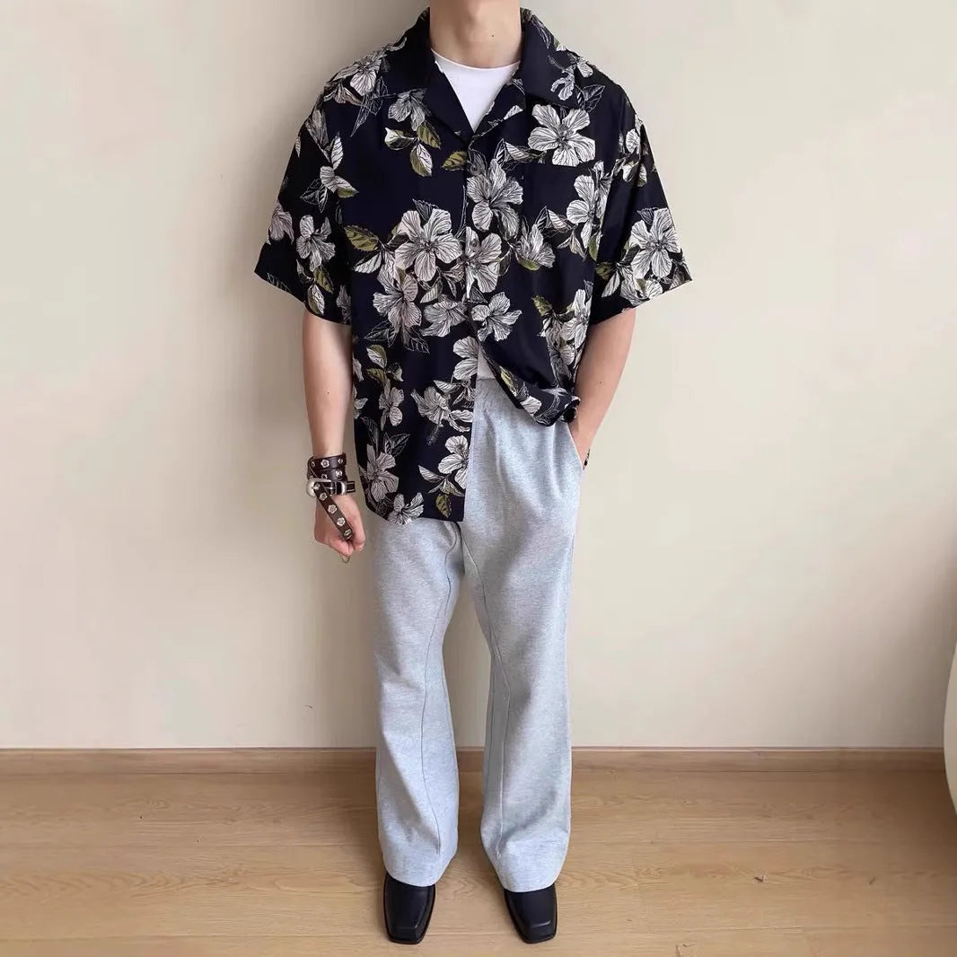 Black men's loose-fit ice silk shirt with vintage Cuban collar, short sleeves, and floral print.