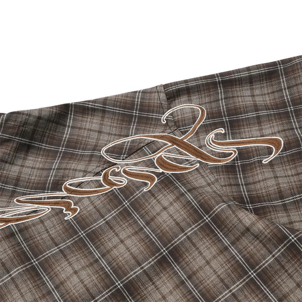Men's black and brown plaid short sleeve shirt with embroidered letter design and lapel collar.