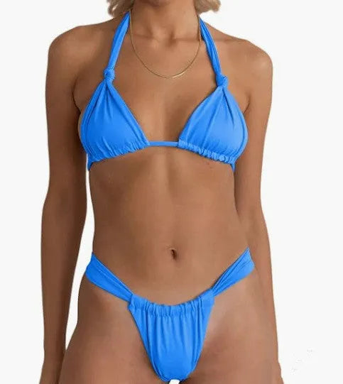 Pink women's bikini with a knotted top, split straps, and matching briefs on a neutral background.