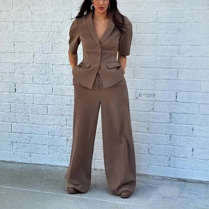 Brown men's polyester two-piece suit with slim fit waist, featuring a long-sleeved top and matching trousers.
