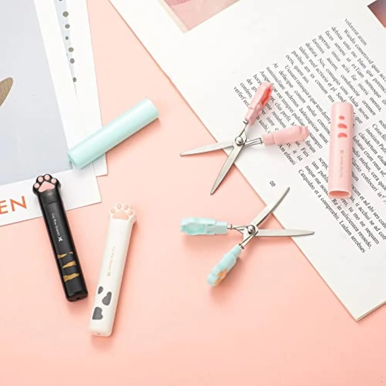 Cat paw mini folding scissors in four colours showing stainless steel blades and compact 8.7cm size