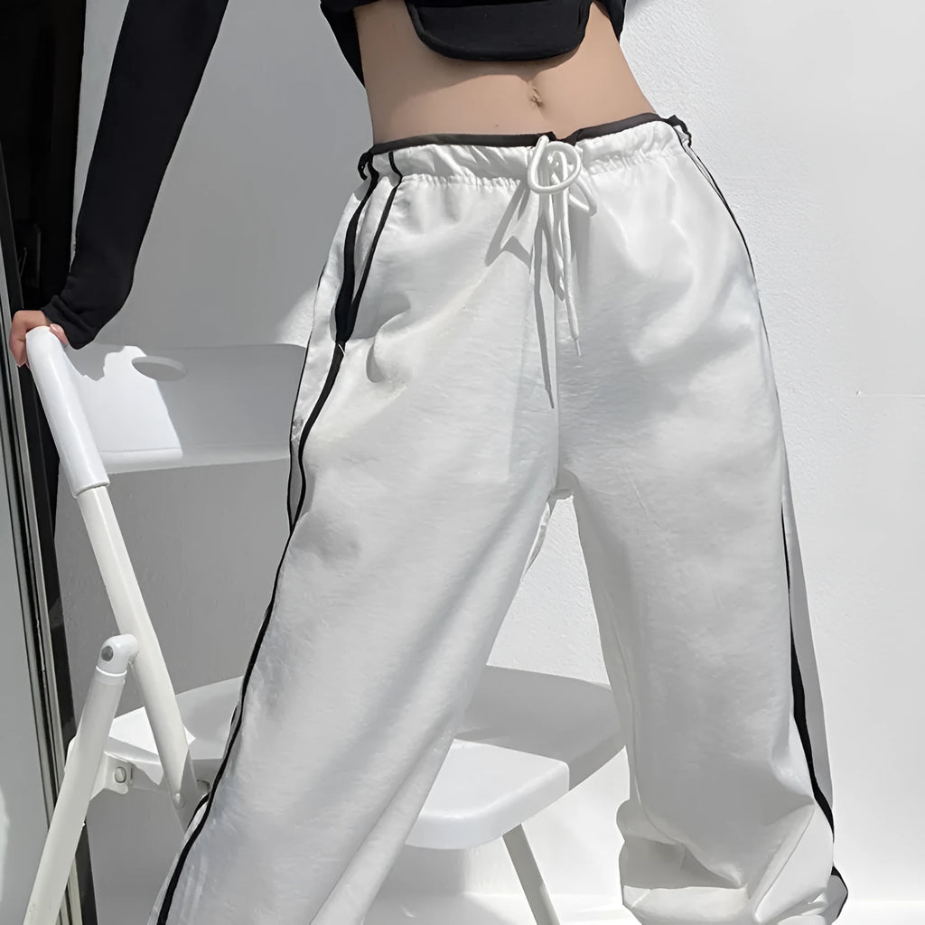 Women's slim straight trousers with parallel bar pattern in thin ribbed fabric, low waist design