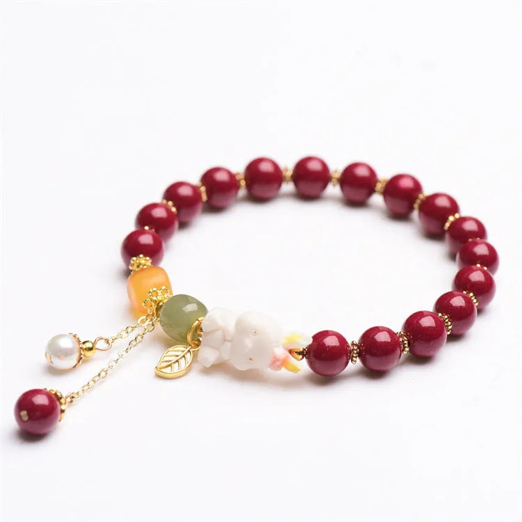 Traditional Chinese cinnabar bracelet with rabbit design, available in 8mm and 10mm bead sizes.