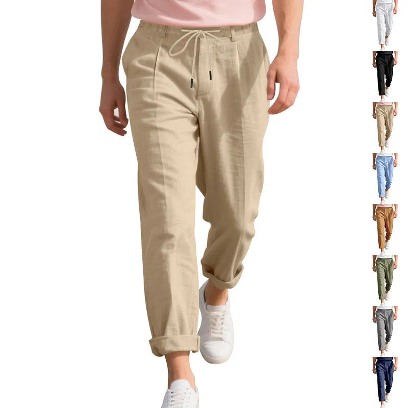 Men's light khaki linen casual trousers with a drawstring waist and straight-leg fit on a hanger.