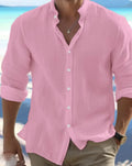 Men's long-staple cotton pullover shirt in light blue with collage stitching detail, laid flat.