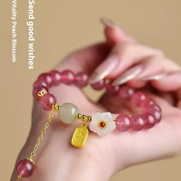 Handmade strawberry quartz crystal bracelet with hetian jade peach blossom elements in five style variations