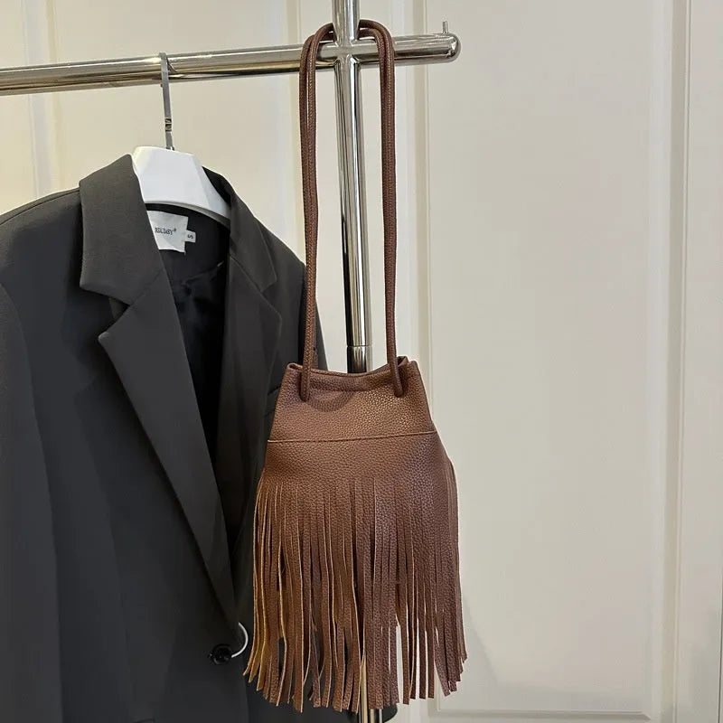 Women's soft leather tassel small satchel in bucket shape with open pocket, five colour options