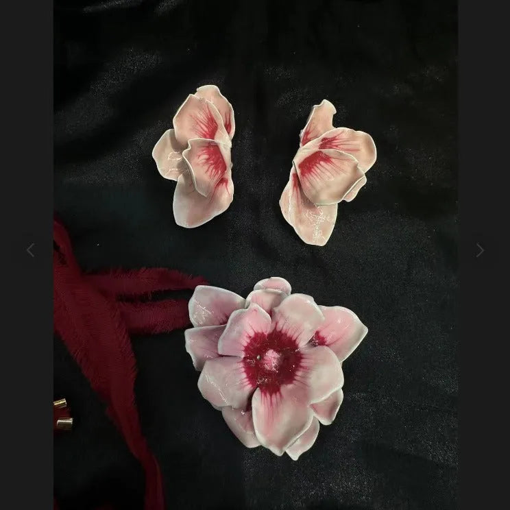 A pair of pastoral style alloy stud earrings with oil-spot glaze floral design in one of four colours.