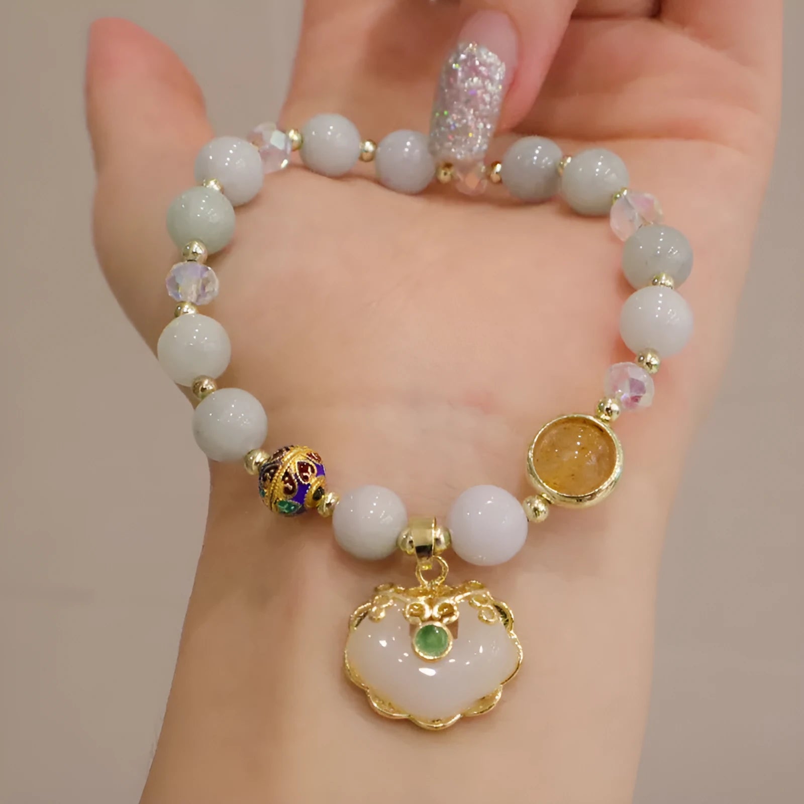 Geometric women's bracelet in gray Jade or Strawberry Quartz with three-dimensional ethnic metal decorations
