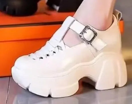 Women's creamy-white satin pumps with a chunky wedge heel and round toe