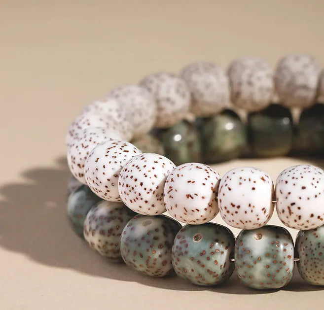 Jade green star moon bodhi bracelet with 10mm geometric beads on white background