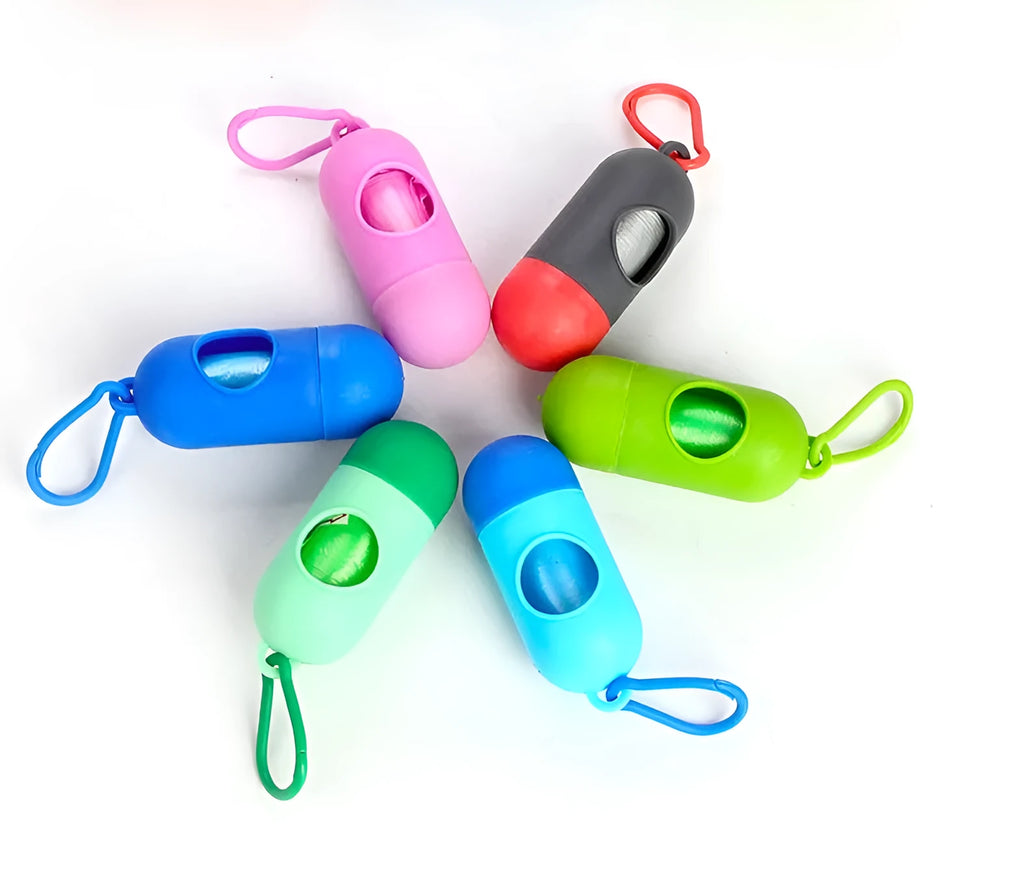 Roll of coloured disposable pet waste bags showing black, blue, green, light blue, pink, and purple options.
