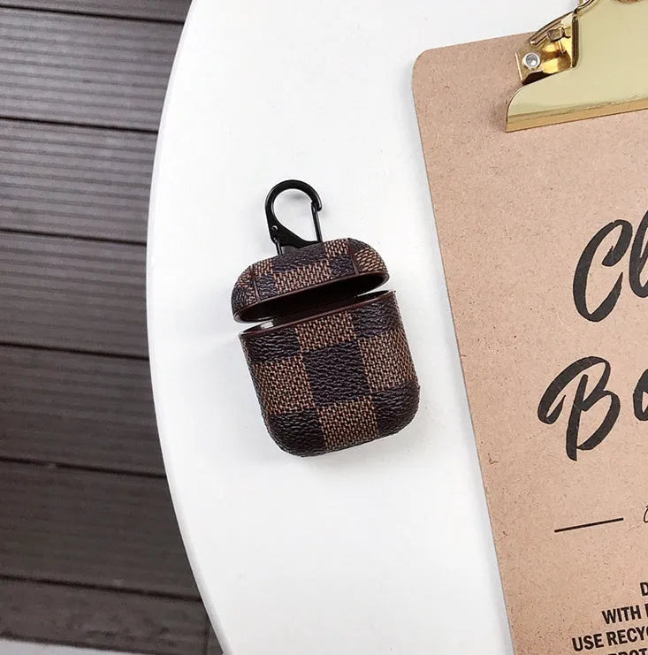 iPhone XS Max hard plastic case with grid texture and a small metal anti-lost hook attached at the corner.