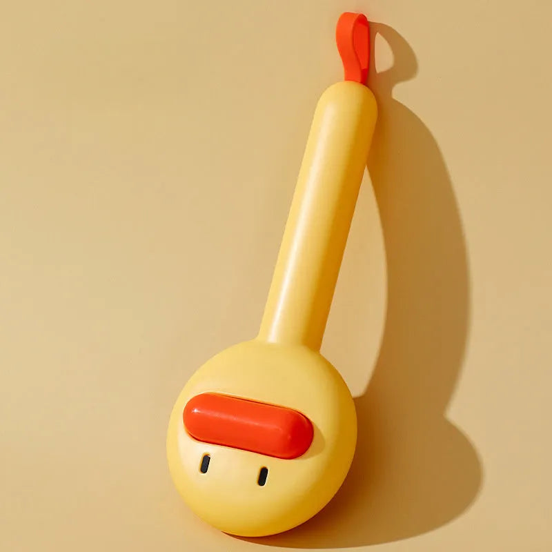 Small yellow duck-shaped pet comb with needle bristles for grooming cats and dogs