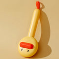 Small yellow duck-shaped pet comb with needle bristles for grooming cats and dogs