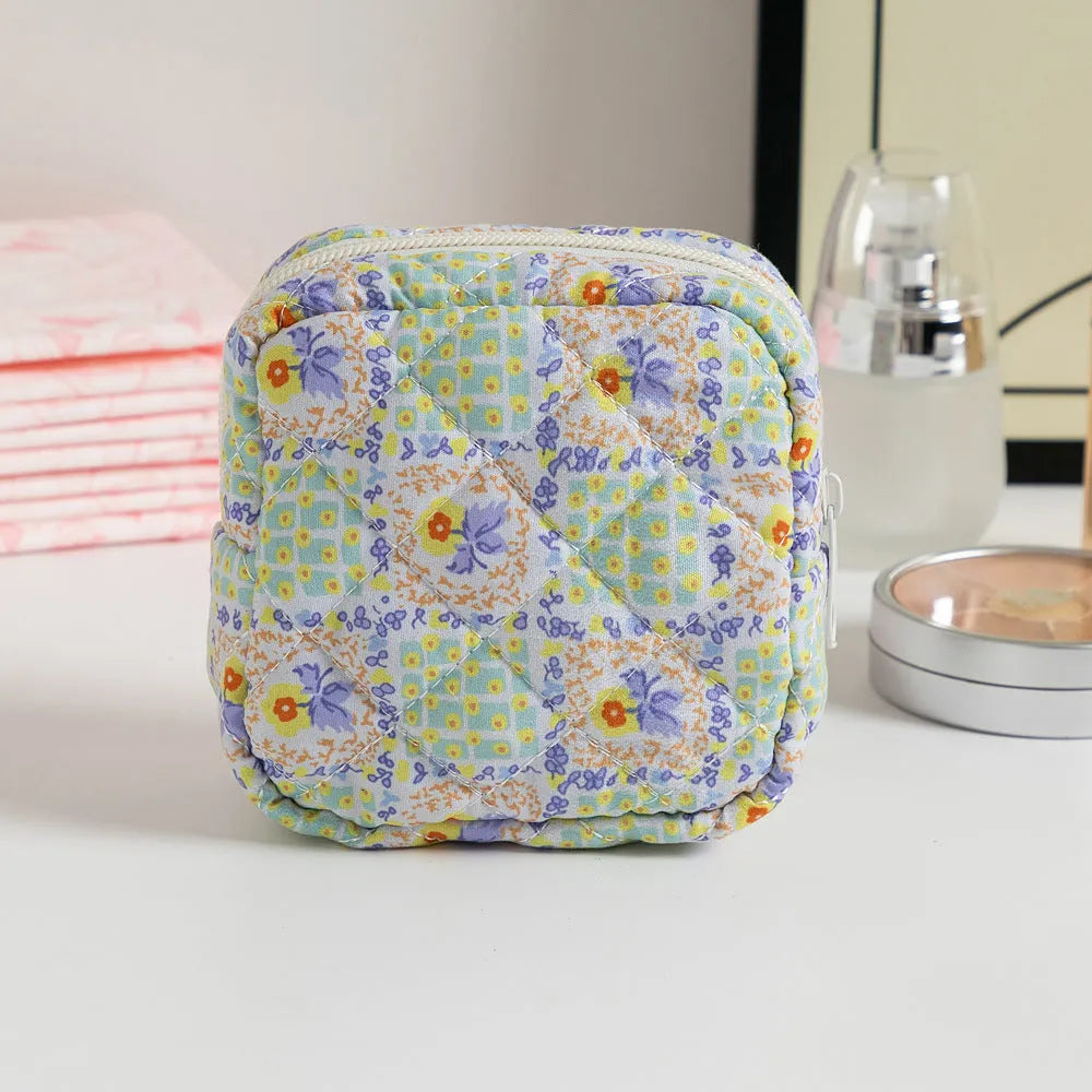 Women's floral patterned polyester key storage bag with sewing thread detail.