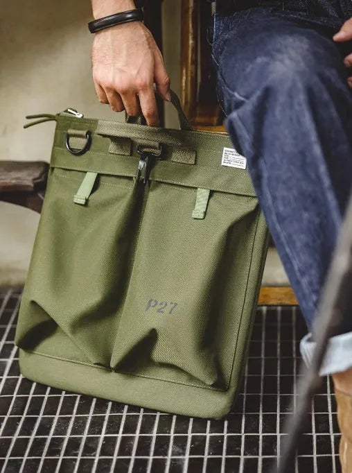 Retro style canvas crossbody messenger bag in military green with adjustable shoulder strap and zipper closure