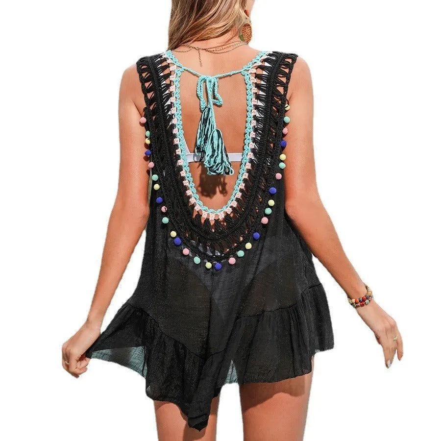 Black hand-crocheted women's beach cover-up vest with ruffled detail and cut-out design