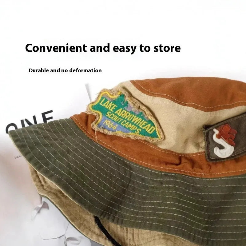 Army green cotton fisherman hat with flat top crown and patchwork detailing